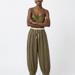 Loose tapered linen trousers for women with pull-on style, featuring a relaxed fit and lightweight fabric for casual wear.