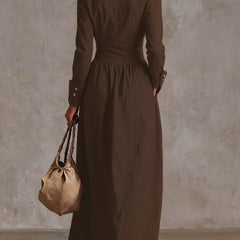 High waisted solid color maxi dress with long sleeves, buttoned front, pleated pockets, and split-joint lapel from My Store.