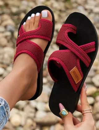 Orthopedic women's slippers with open-toe design and heel, featuring supportive soles and comfortable padding.