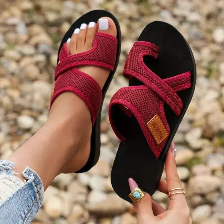 Orthopedic women's slippers with open-toe design and heel, featuring supportive soles and comfortable padding.