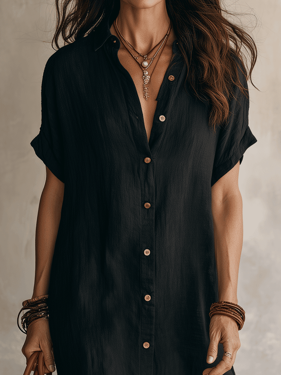 Black linen relaxed midi dress for women by Tammy Bradley, featuring a comfortable, flowy silhouette and midi length.