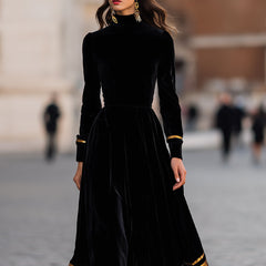 Elegant velvet midi dress with gold trim, stylish women's dress featuring a sophisticated design and luxurious fabric.