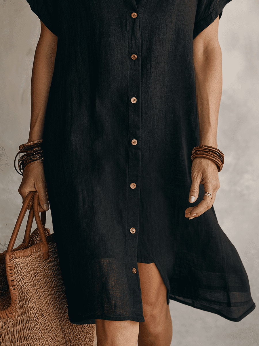 Black linen relaxed midi dress for women by Tammy Bradley, featuring a flowing silhouette and casual elegant style.