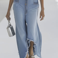 Light blue denim sleeveless wide-leg jumpsuit with raw edges, designed for women, featuring a stylish and relaxed fit.