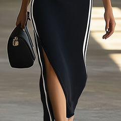 Black knit V-neck maxi dress for women, stylish and comfortable, featuring a flowing silhouette and long length.