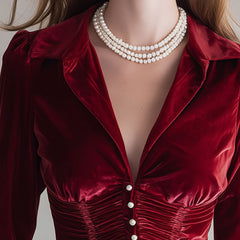 Red velvet pleated ruffled long sleeve blouse with a chic design, perfect for stylish occasions.