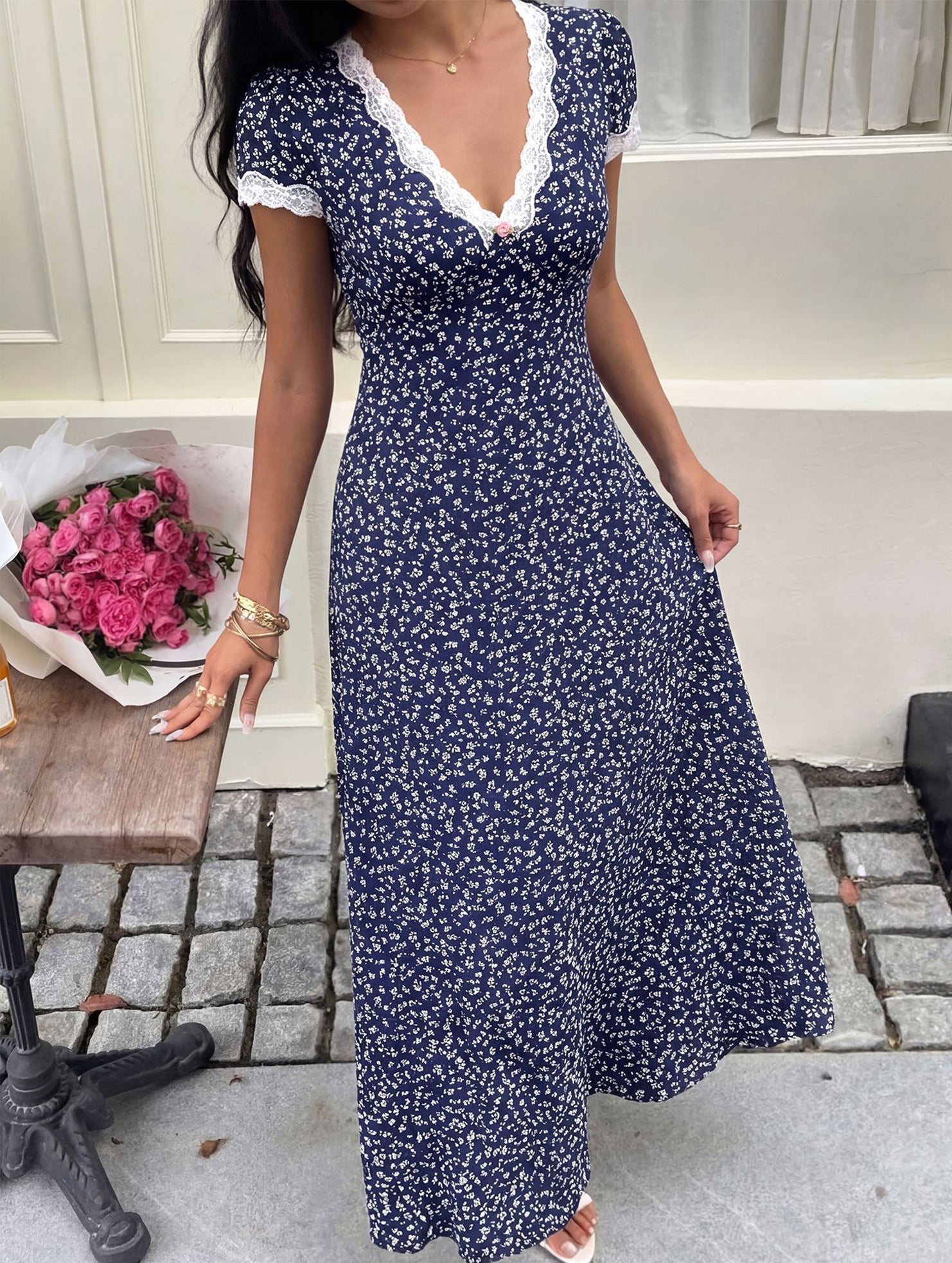 White floral lace patch V-neck maxi dress with long sleeves and flowing skirt, perfect for elegant occasions.