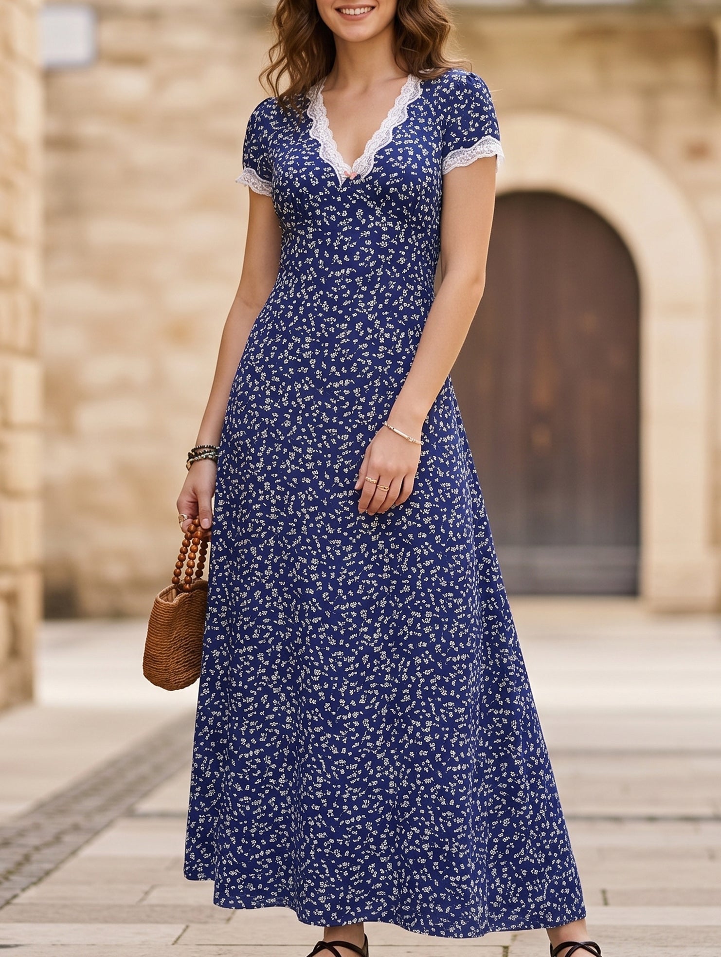 White lace patch floral V-neck maxi dress featuring delicate floral lace details and a flowing silhouette.