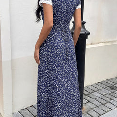 White floral lace patch V-neck maxi dress with long sleeves, elegant and flowing, perfect for summer or special occasions.