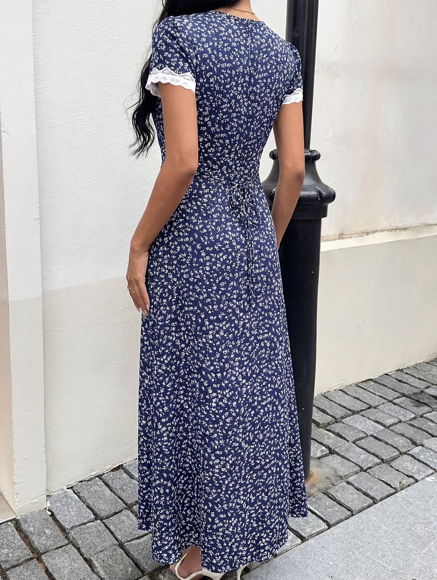 White floral lace patch V-neck maxi dress with long sleeves, elegant and flowing, perfect for summer or special occasions.