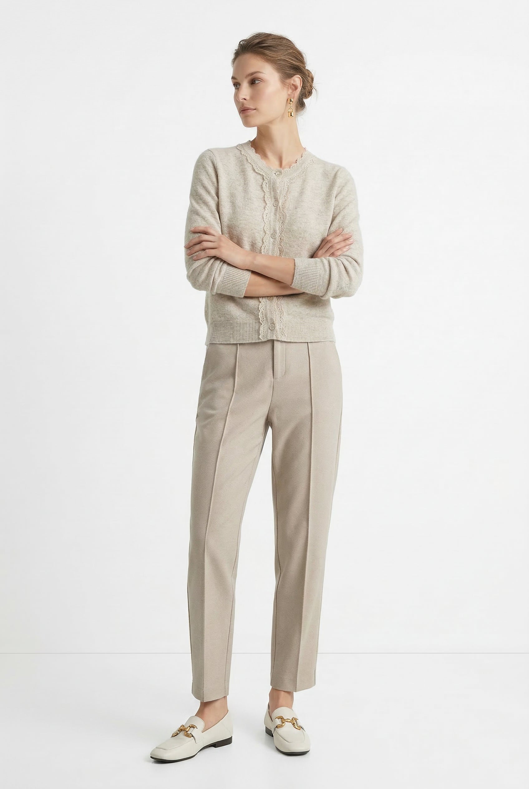 Women's wool tapered trousers in merino wool, stylish and comfortable pants for women, shown in a modern outfit.