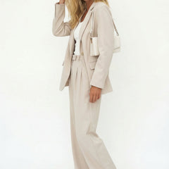 White wide-leg high-waist trousers for women, stylish high-waist pants with a relaxed fit and modern design.