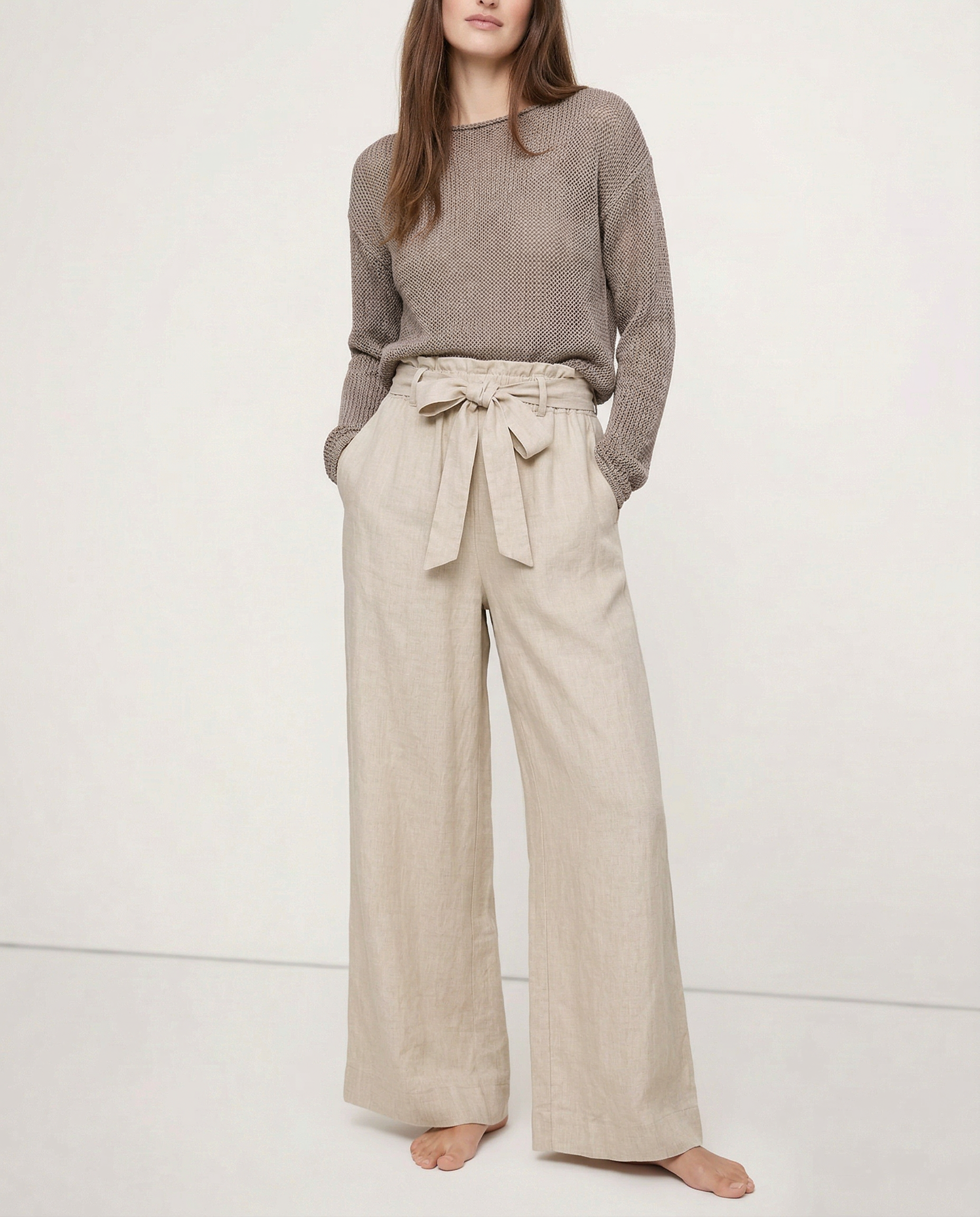 Linen wide-leg trousers for women with a loose fit and pull-on style, showcasing soft fabric and relaxed silhouette.
