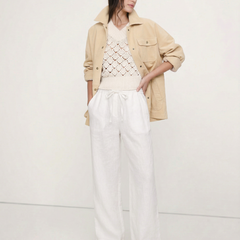 Light beige linen wide-leg trousers for women, featuring loose pull-on design and high-quality fabric, shown on model.