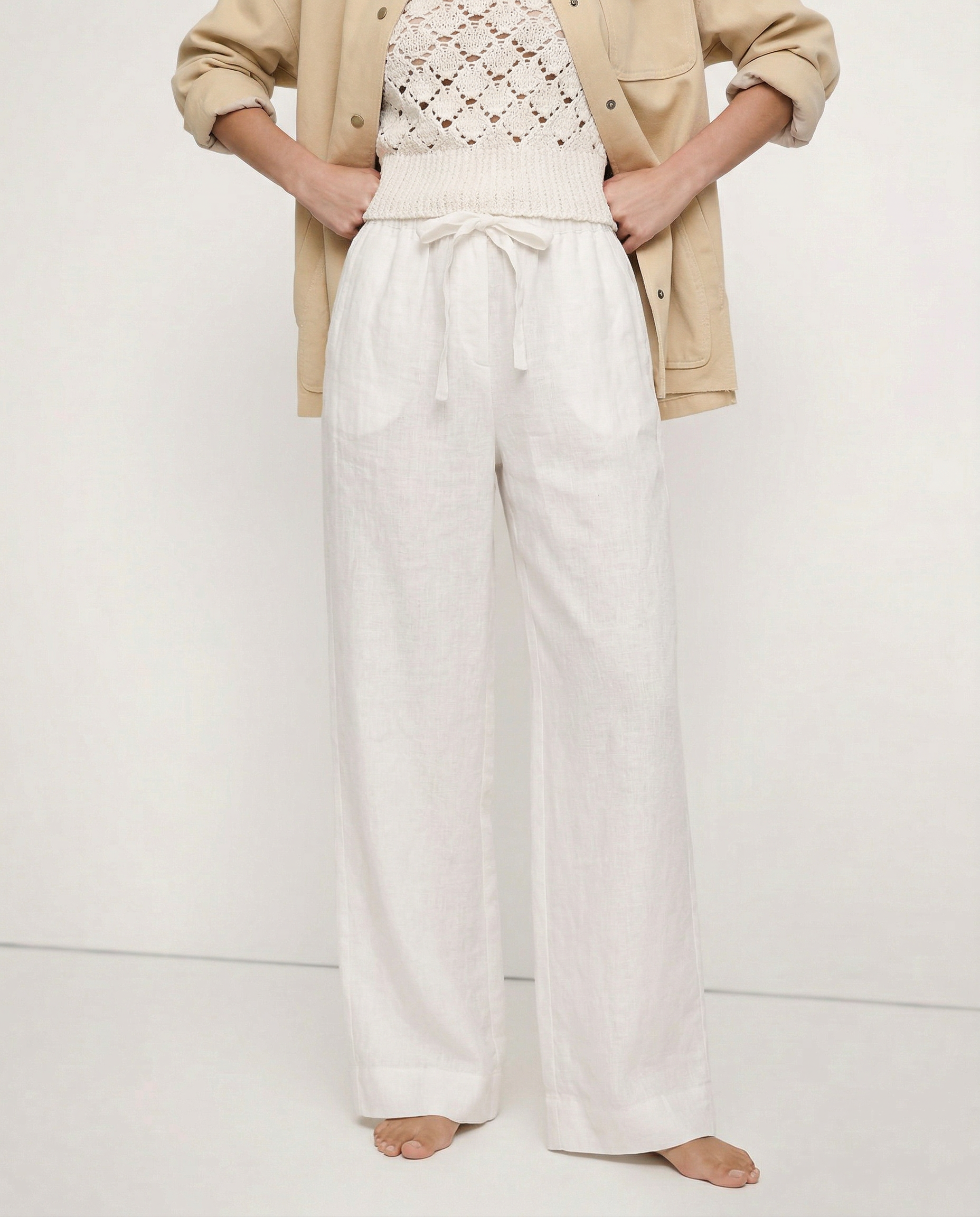 Linen wide-leg trousers for women, loose pull-on pants in soft linen fabric, shown in a natural relaxed fit with high waist design.