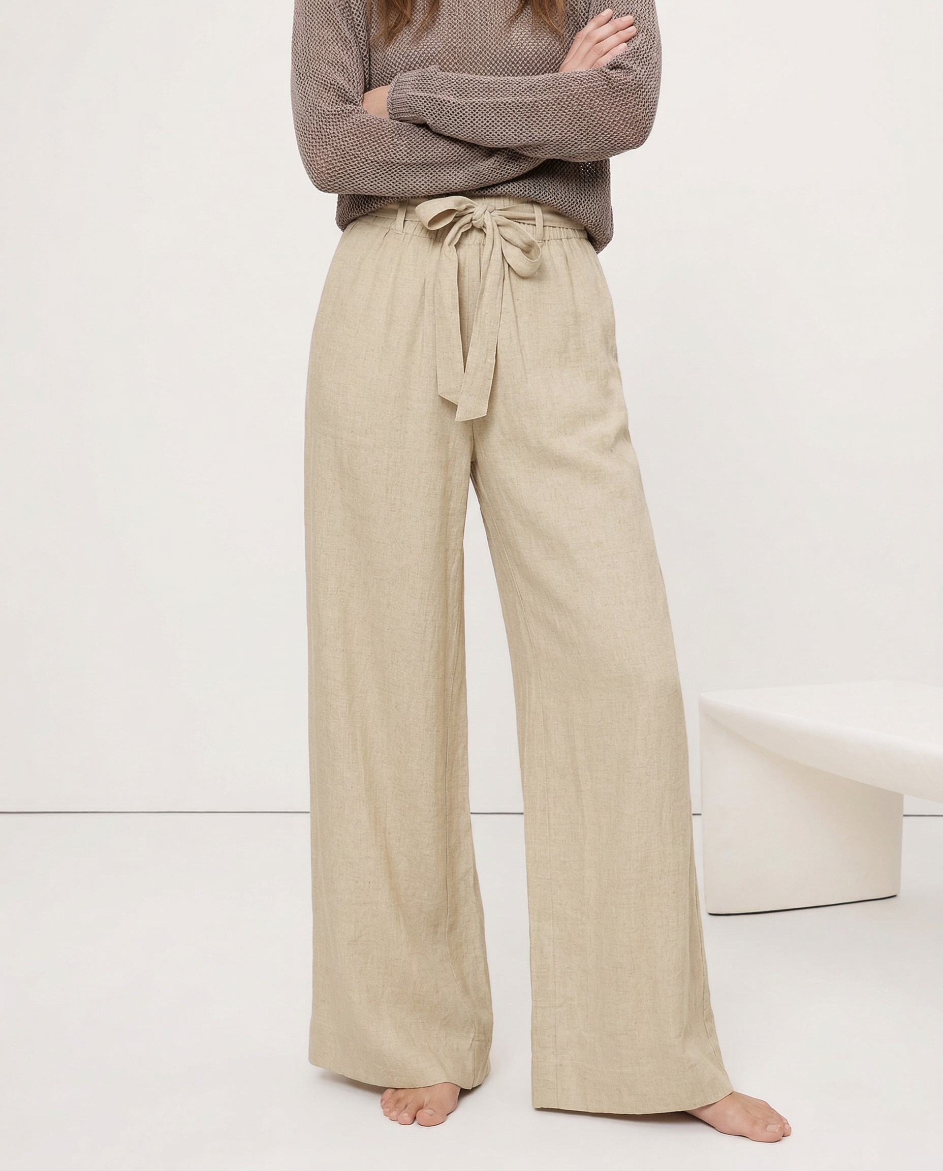 Linen wide-leg trousers for women with a loose pull-on style, showing soft, breathable fabric and relaxed fit.