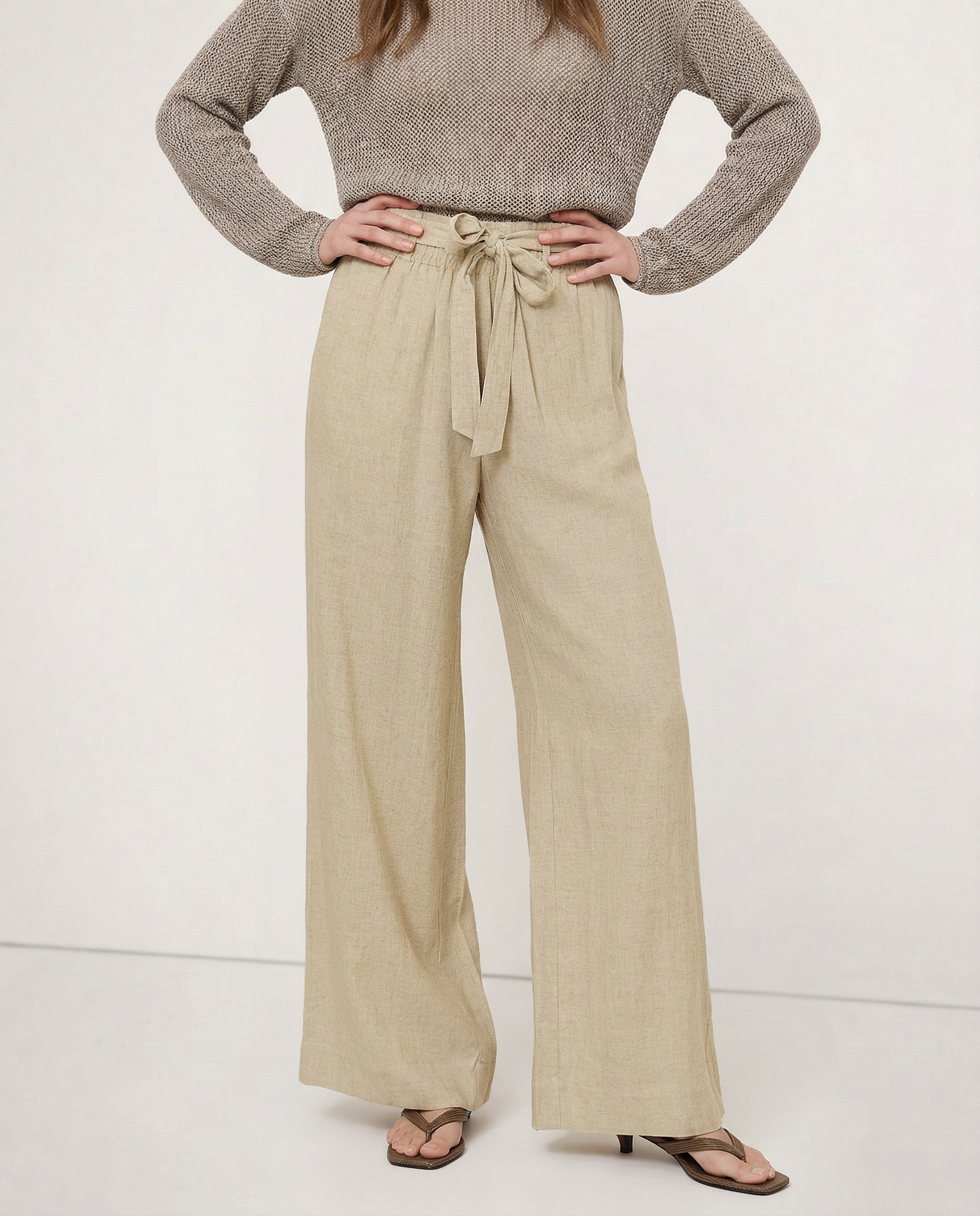 Linen wide-leg women's trousers with loose fit and pull-on style, showcasing soft, breathable fabric in a relaxed fit.