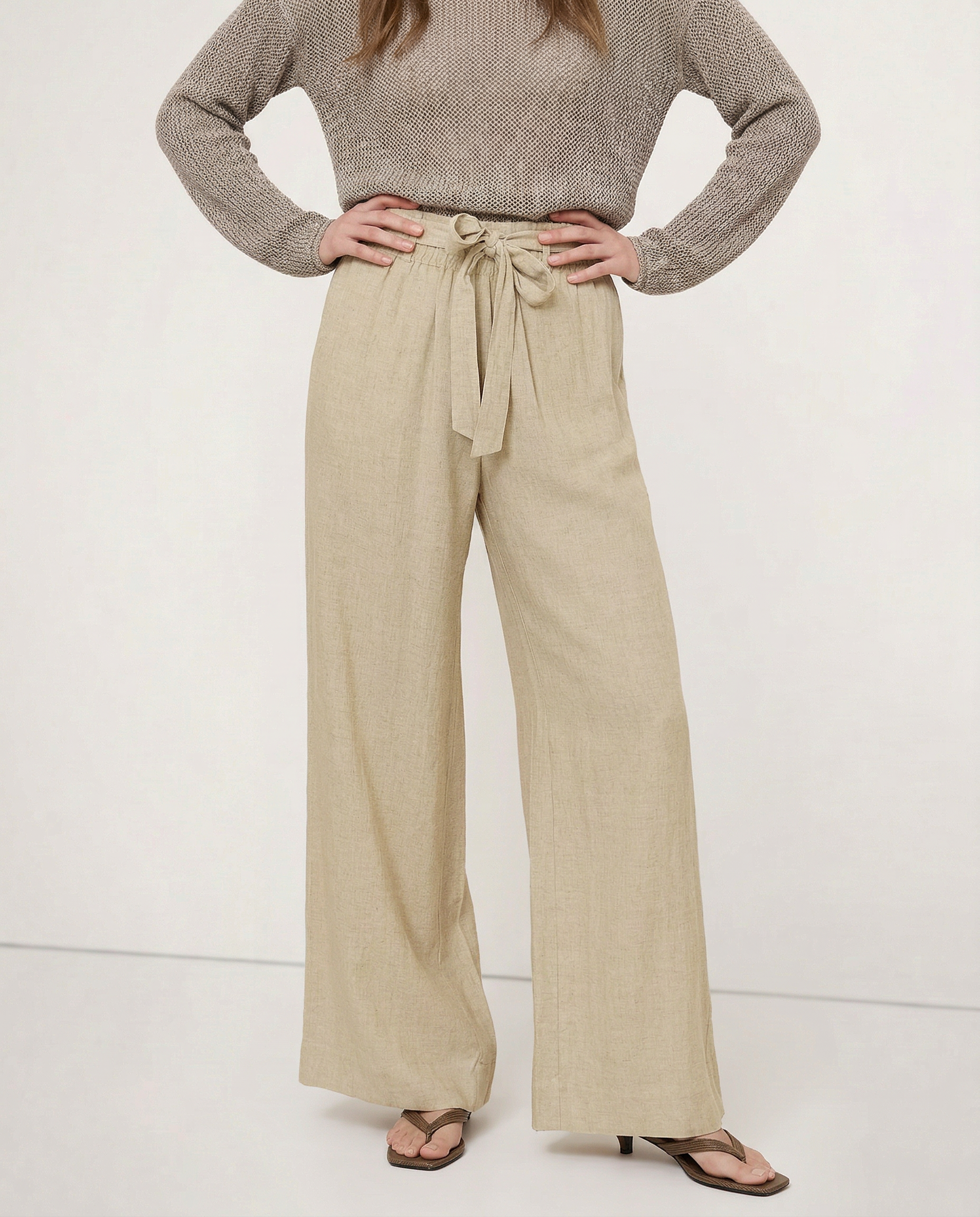 Linen wide-leg women's trousers with loose fit and pull-on style, showcasing soft, breathable fabric in a relaxed fit.
