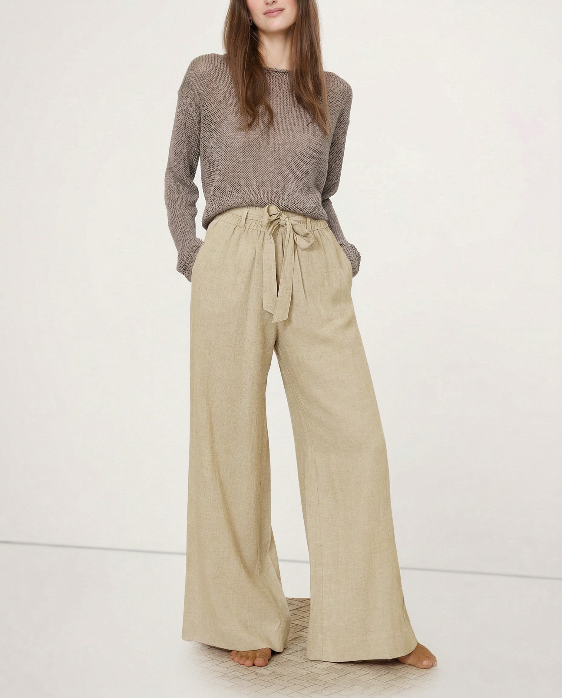 Linen wide-leg women's pants with loose fit and pull-on style, showing soft fabric and relaxed design.