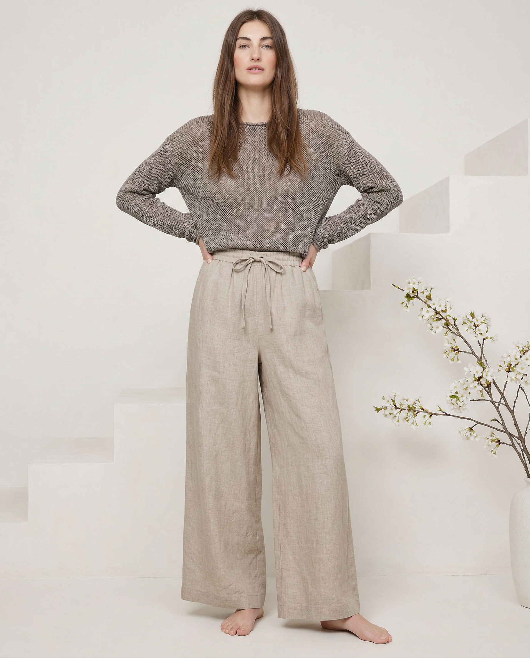 Linen wide-leg women's trousers with a loose pull-on design, showcasing soft fabric and relaxed fit.