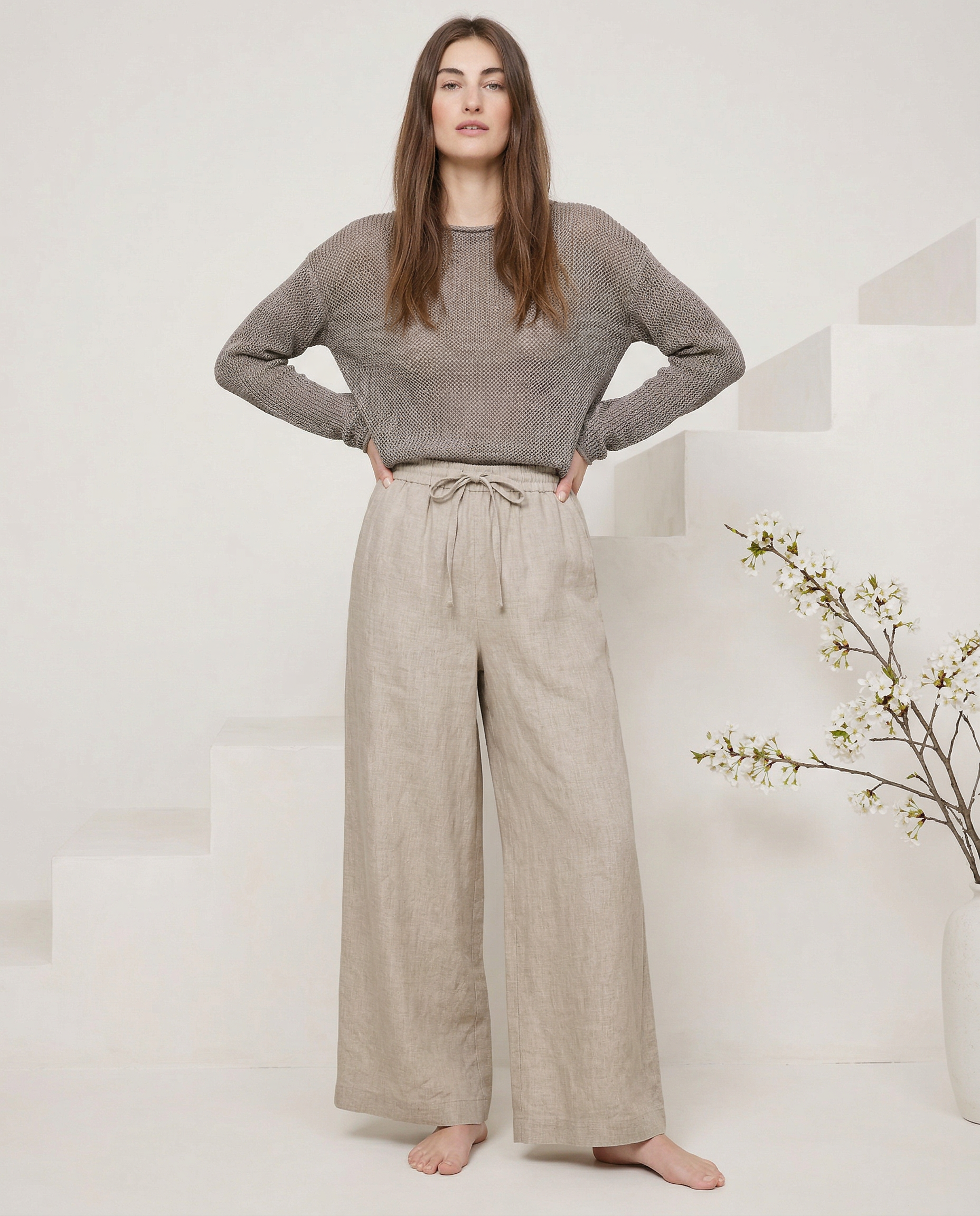 Linen wide-leg women's trousers with a loose pull-on design, showcasing soft fabric and relaxed fit.