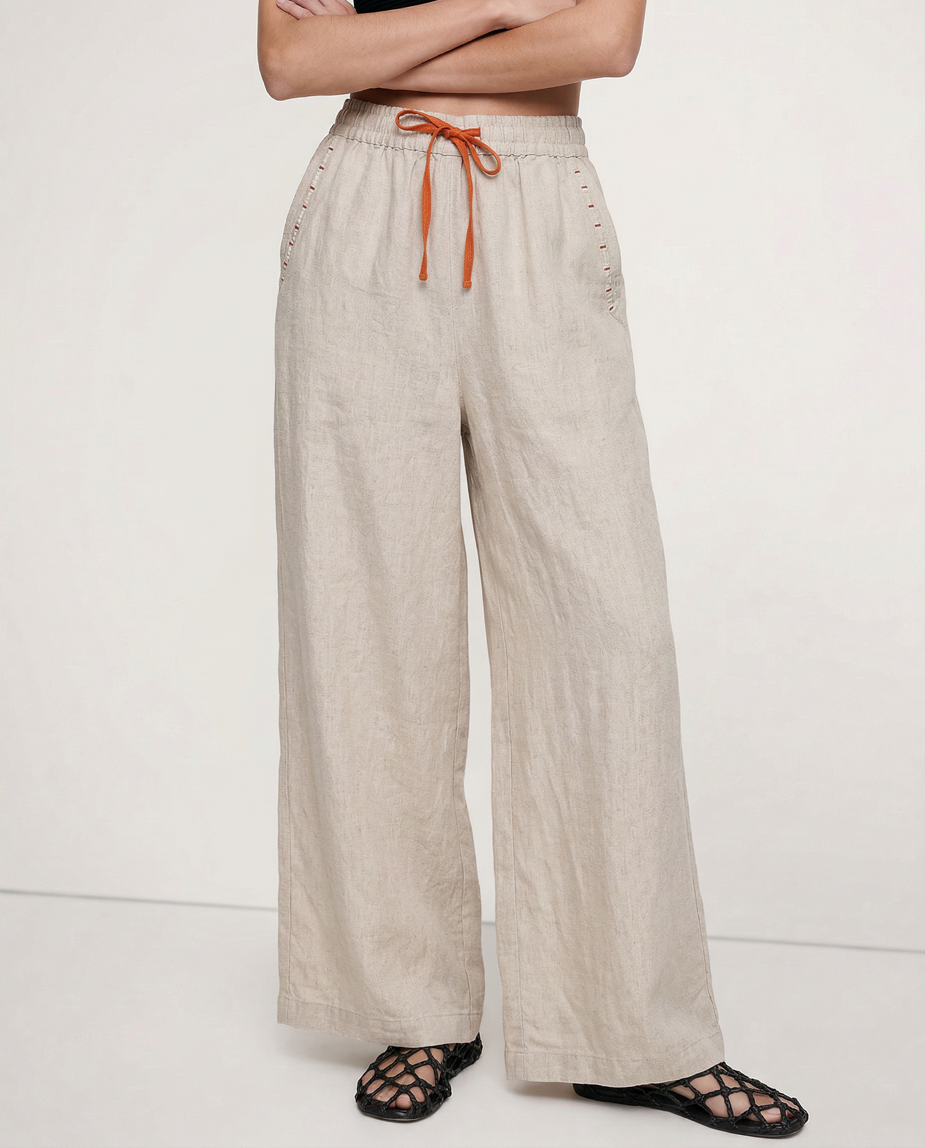 Women's linen wide-leg drawstring trousers featuring a loose fit and high-quality fabric, perfect for casual and summer wear.