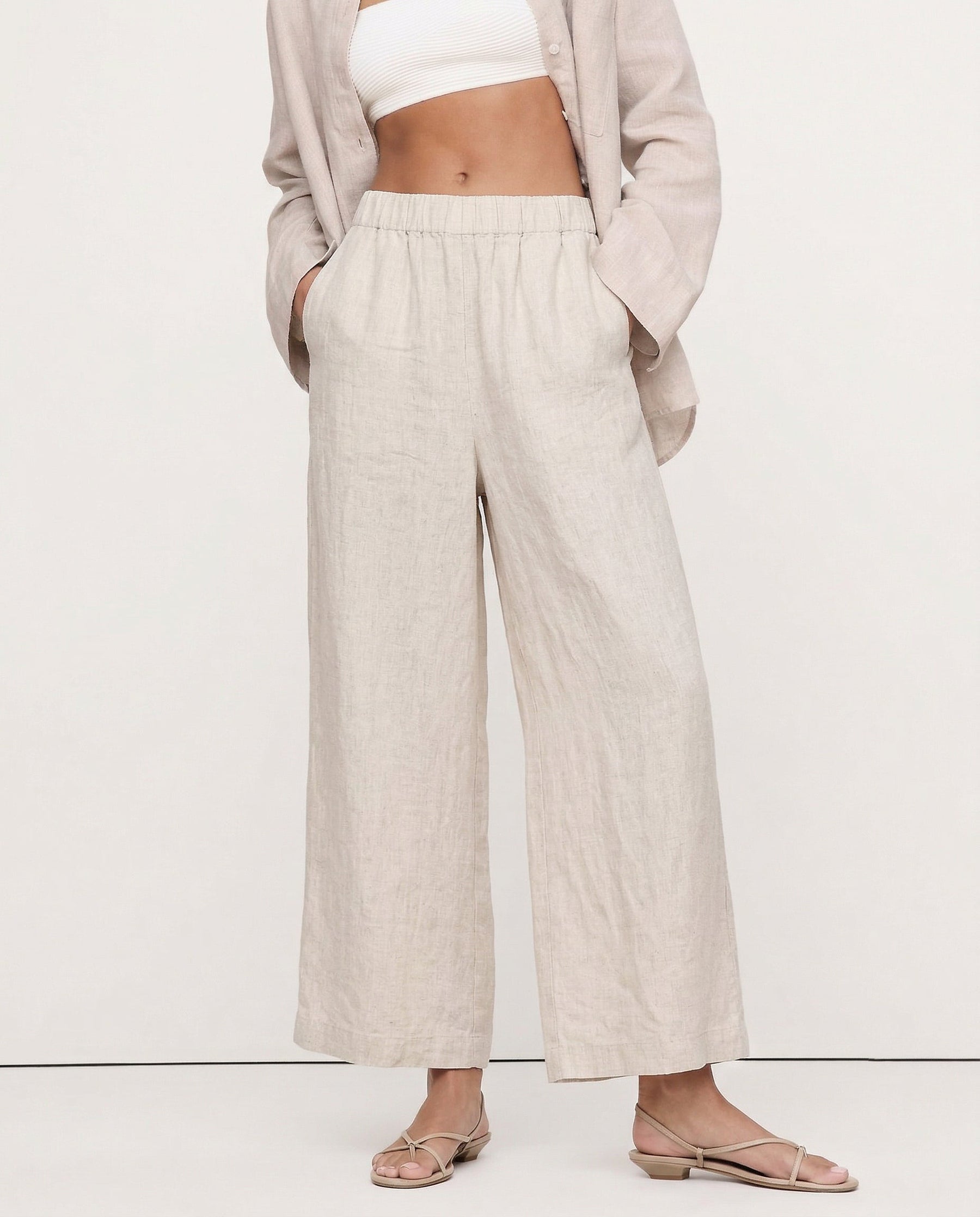 Linen cropped wide-leg drawstring trousers for women, showing high-quality fabric and relaxed fit, perfect for casual wear.