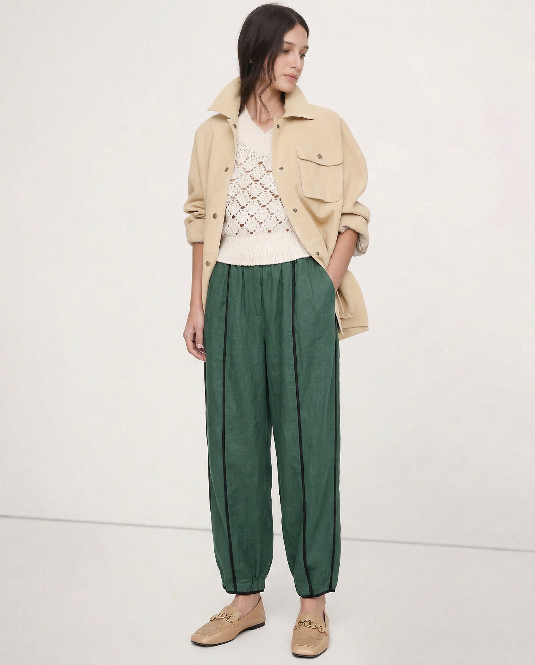 Striped wide-leg linen trousers for women, showing the relaxed fit, high-quality linen fabric, and stylish design.