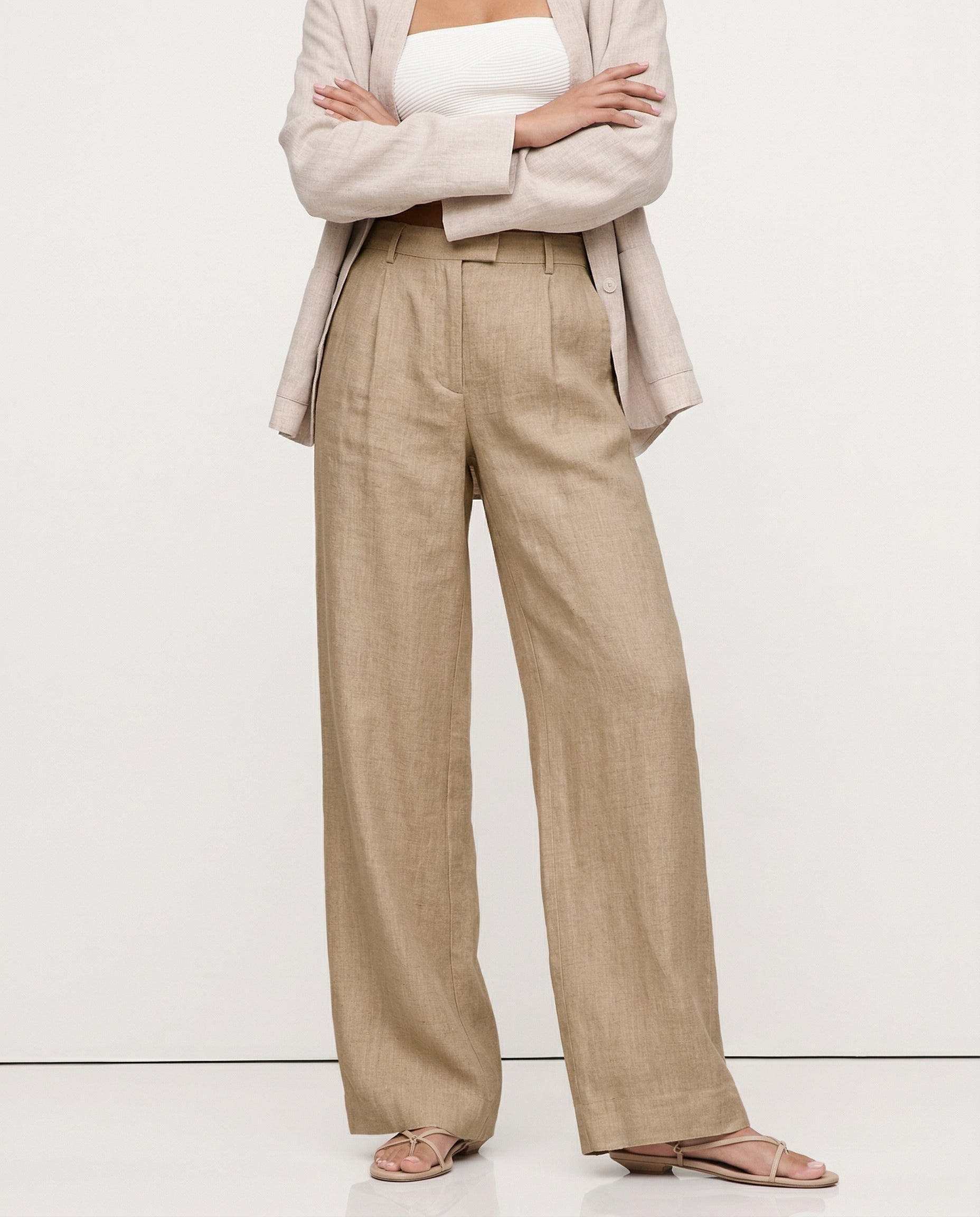 Women's high-waist wide-leg linen blend trousers with a loose pull-on fit, shown in a realistic, high-quality fabric.