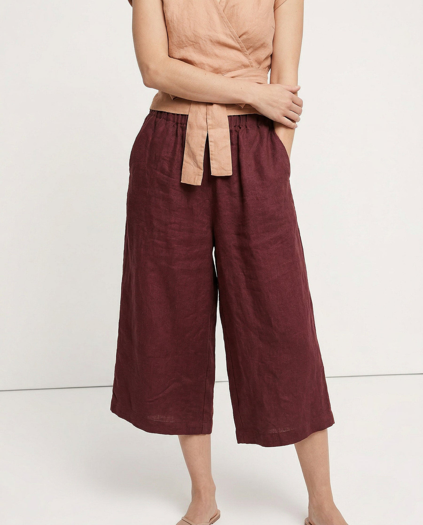 Linen cropped wide-leg drawstring trousers for women, showing soft, high-quality linen fabric and relaxed fit.