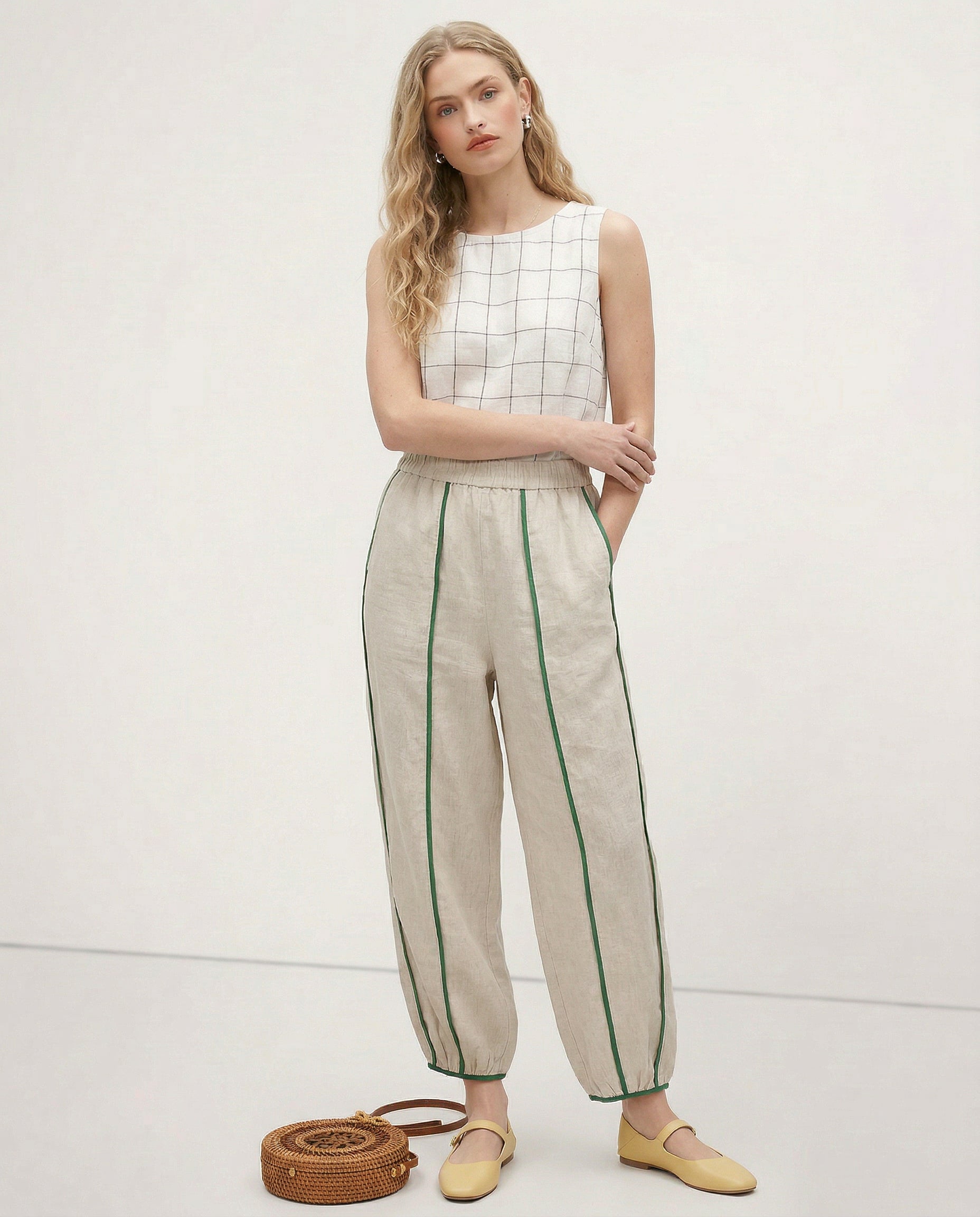 Linen wide-leg elastic-waist trousers for women, showing soft, high-quality linen fabric and relaxed fit in a realistic style.