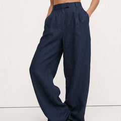 Women's high-waist wide-leg linen blend trousers with a loose pull-on design, showcasing the fabric quality and relaxed fit.