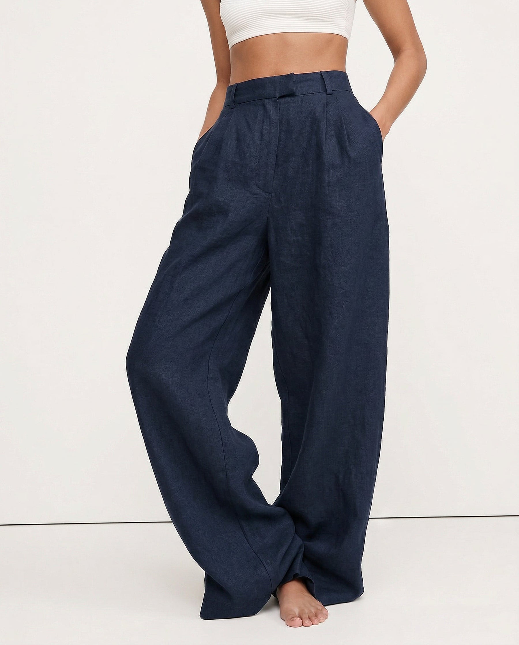 Women's high-waist wide-leg linen blend trousers with a loose pull-on design, showcasing the fabric quality and relaxed fit.