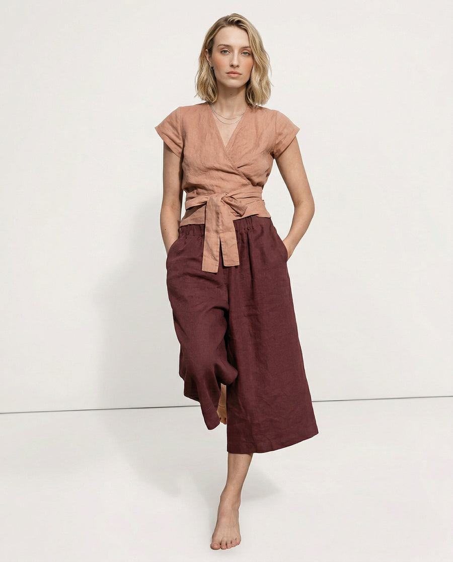 Linen cropped wide-leg drawstring trousers for women, showing high-quality, realistic linen fabric with a relaxed fit.