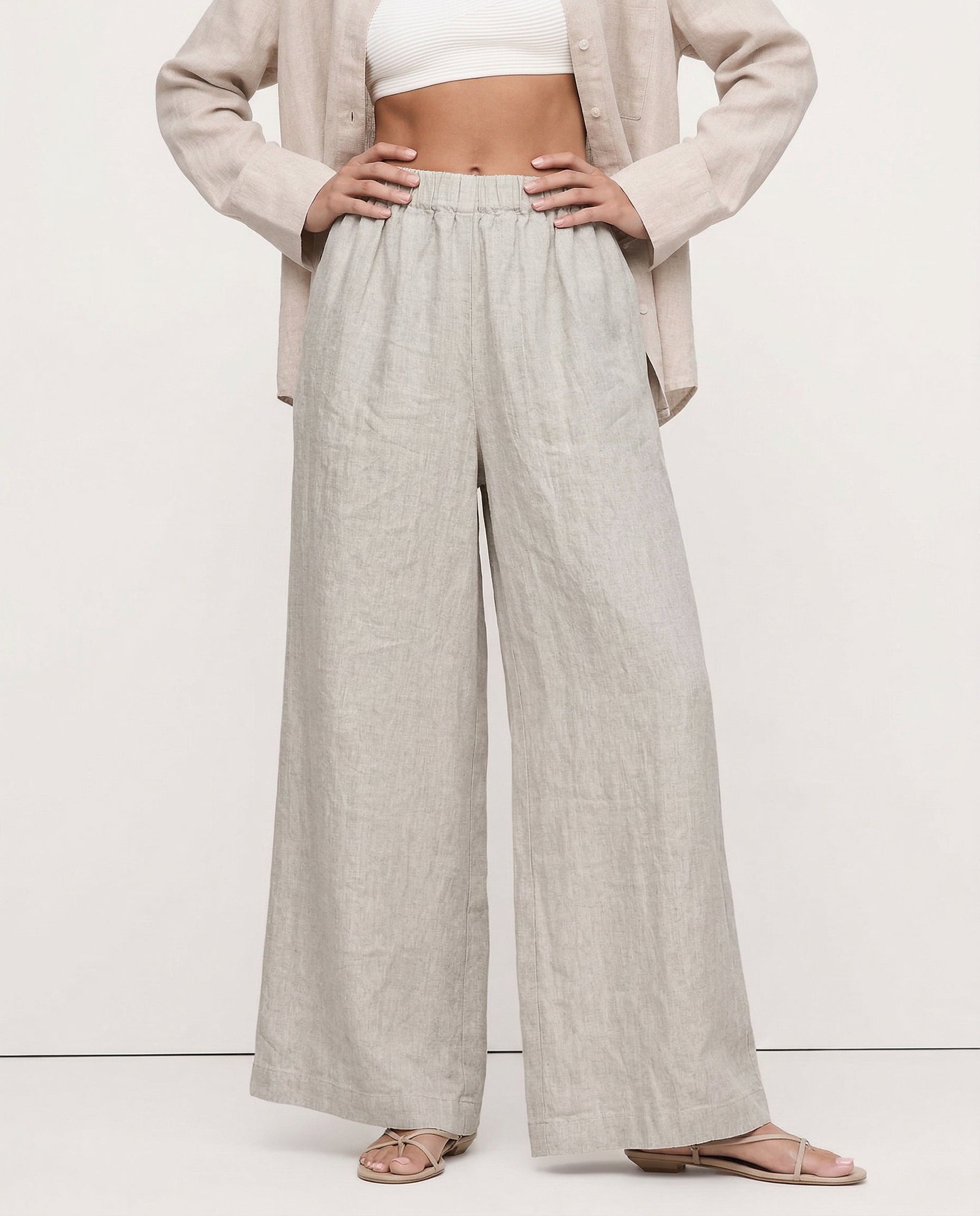 Linen cropped wide-leg drawstring trousers for women, featuring a loose fit and high-quality fabric, styled for casual comfort.