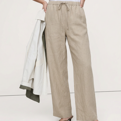 Women's knit wide-leg drawstring trousers with a loose fit, shown on a model, featuring a comfortable pull-on design.
