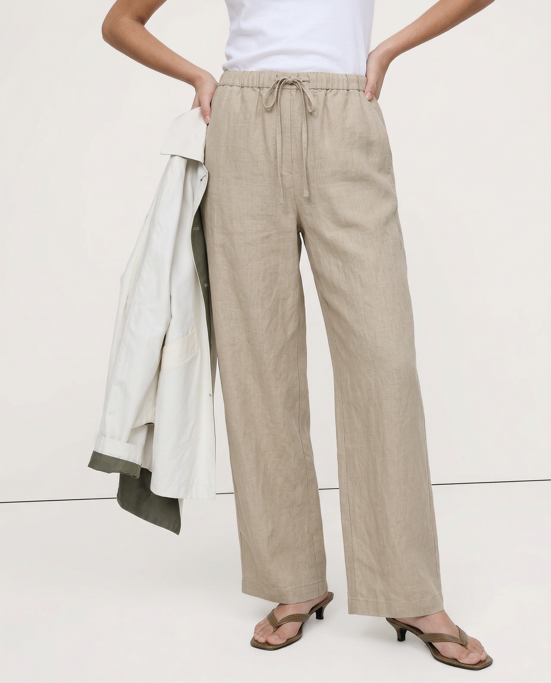 Women's knit wide-leg drawstring trousers with a loose fit, shown on a model, featuring a comfortable pull-on design.