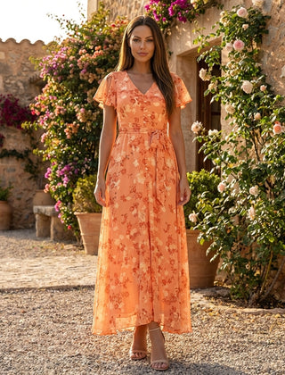 Floral chiffon midi dress with short sleeves and a flowy skirt, featuring a vibrant floral pattern and elegant design.