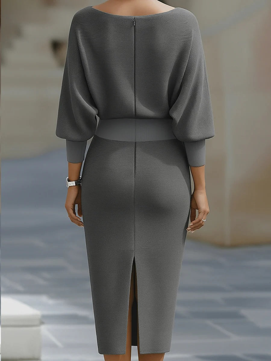 White batwing-sleeve waist-cinching dress for women by Tammy Bradley, shown on a model with a flowing silhouette.