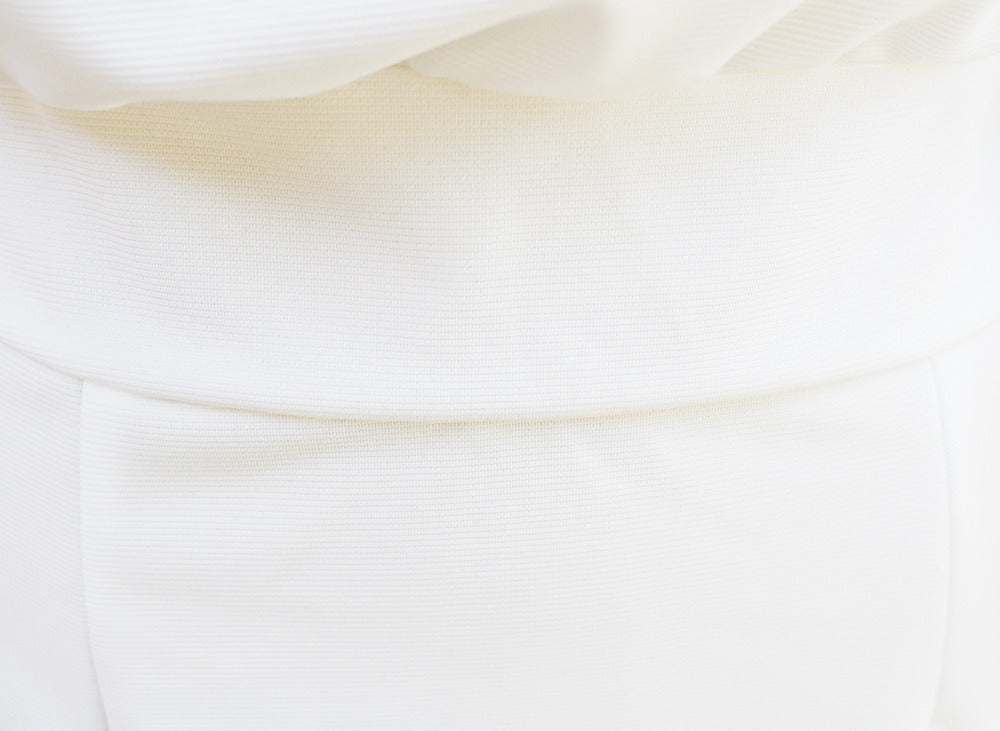 White batwing-sleeve waist-cinching dress for women by Tammy Bradley, shown hanging with a flattering silhouette.