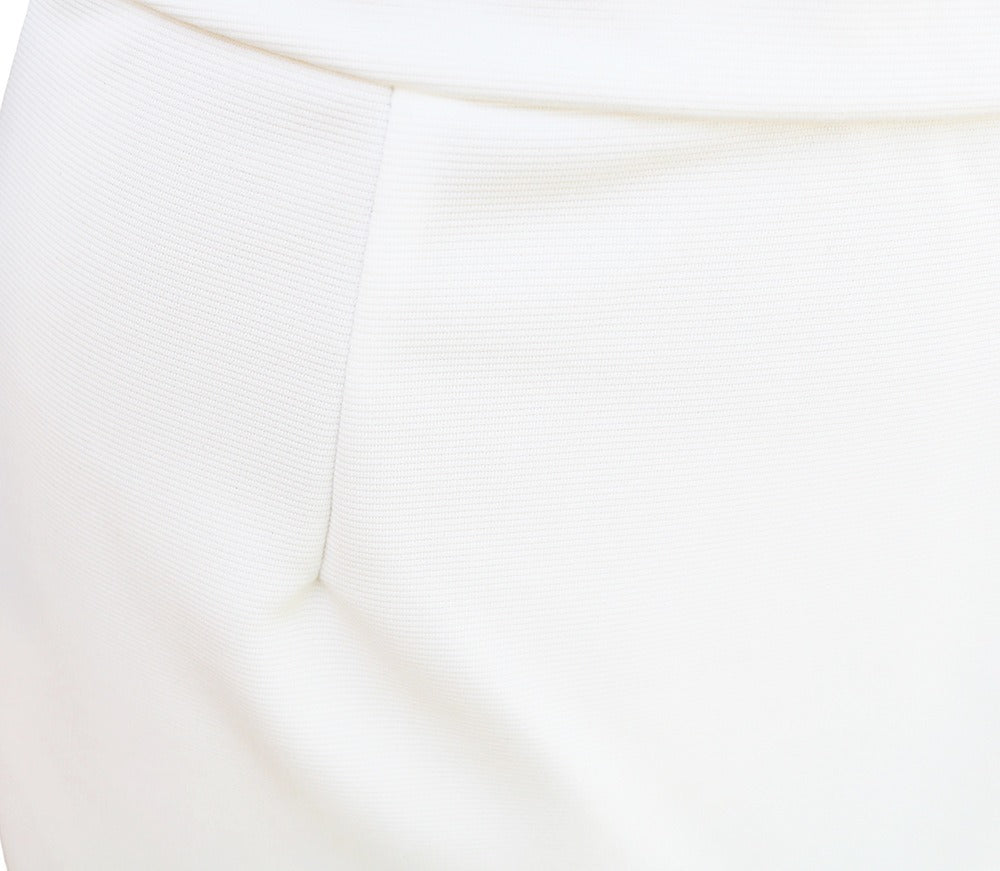 White batwing-sleeve waist-cinching dress for women by Tammy Bradley, shown on a model with a flowing, stylish silhouette.