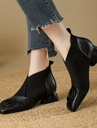 Women's orthopedic ankle boots with heels and non-slip soles, stylish and supportive footwear for comfortable walking.