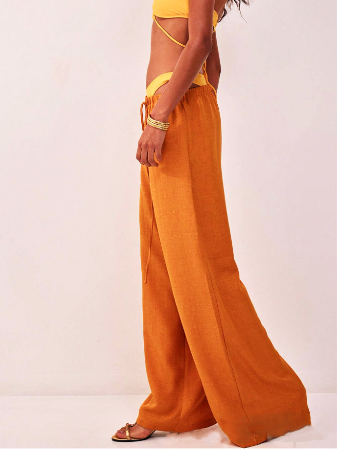 Linen-blend wide-leg women's pants, loose pull-on style, in neutral color, showing relaxed fit and comfortable waistband.