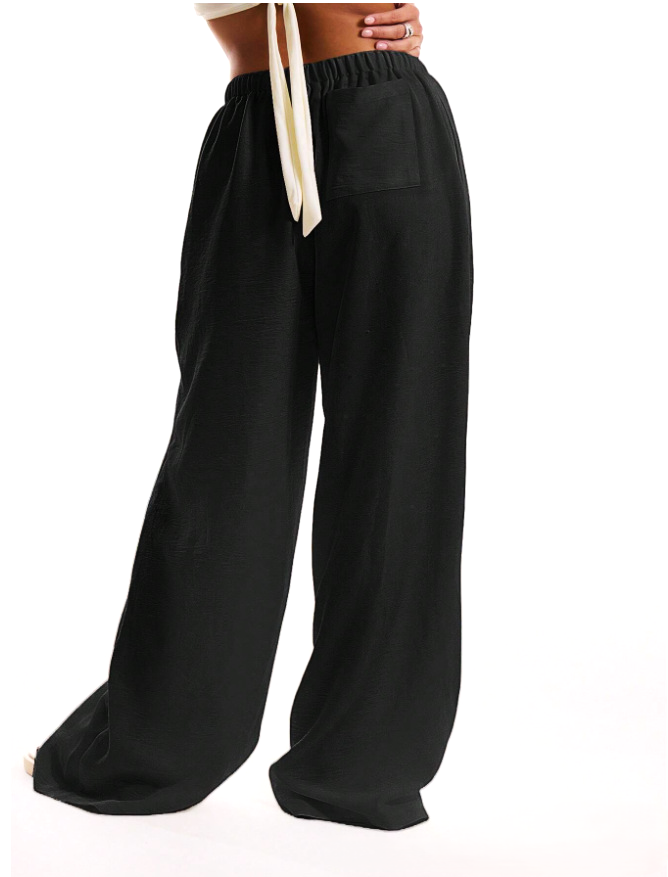 Linen-blend wide-leg women's trousers with a loose pull-on style, shown in a natural relaxed fit and light fabric.