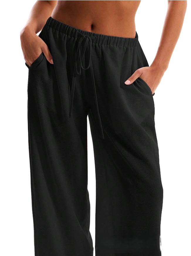 Linen-blend wide-leg trousers for women, loose pull-on pants featuring a relaxed fit and natural fabric in neutral tones.
