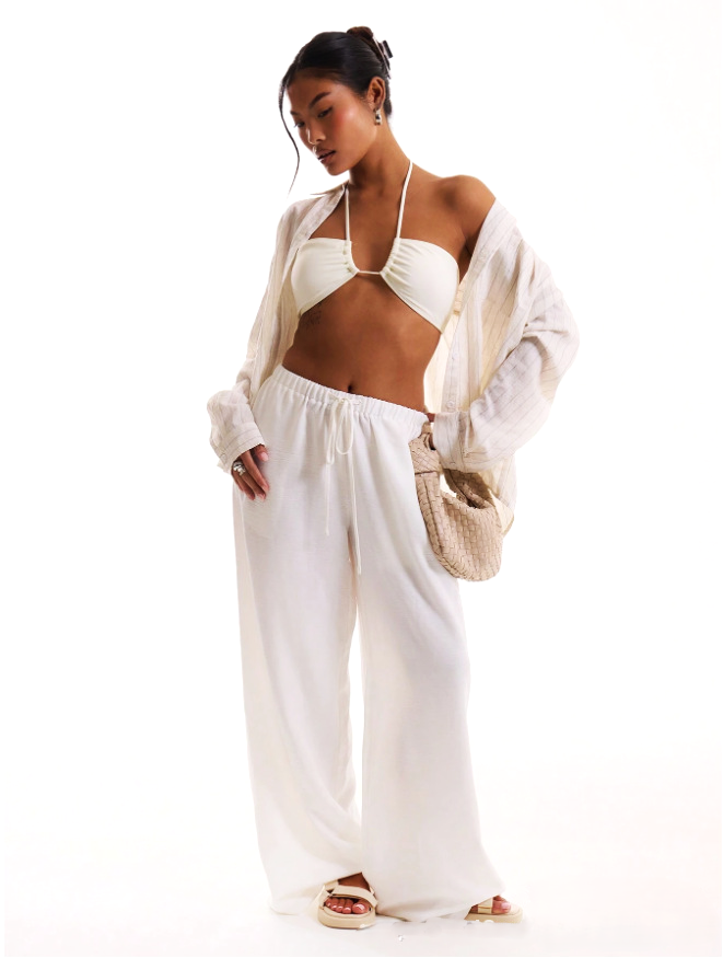 Linen-blend wide-leg women's trousers, loose pull-on pants in neutral fabric, styled for a relaxed, comfortable fit.