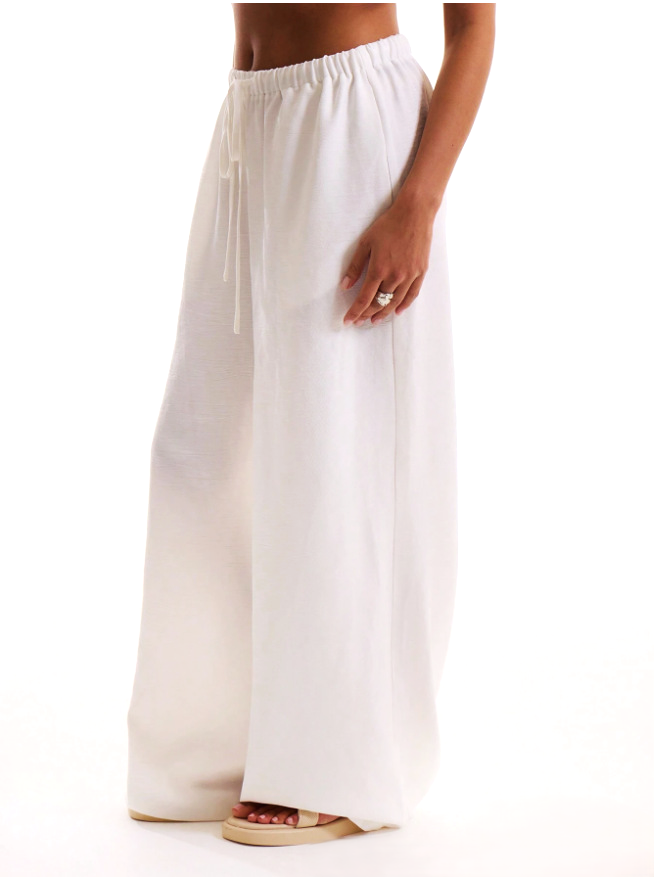 Linen-blend wide-leg women's trousers with a loose pull-on design, featuring a relaxed fit and neutral color.