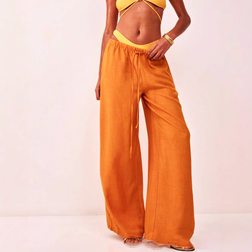 Linen-blend wide-leg pull-on trousers for women, loose fit, casual style, natural fabric, in neutral color.