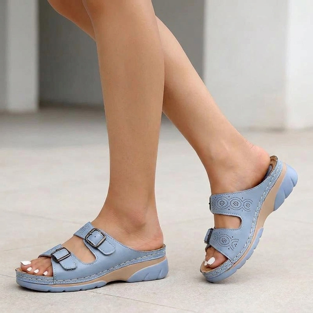 Light blue Tammy Bradley buckle platform slide sandals for women, featuring a comfortable slip-on design and stylish chunky sole.
