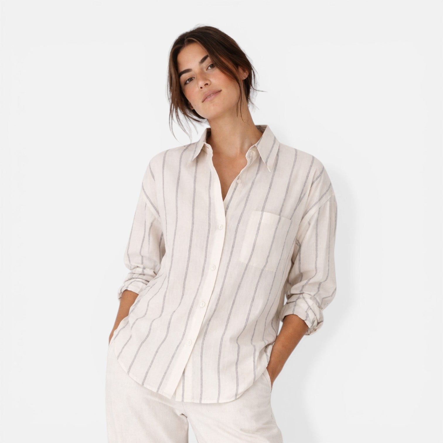 Lightweight women's striped button-down shirt with a relaxed fit, featuring classic vertical stripes and a casual, stylish look.